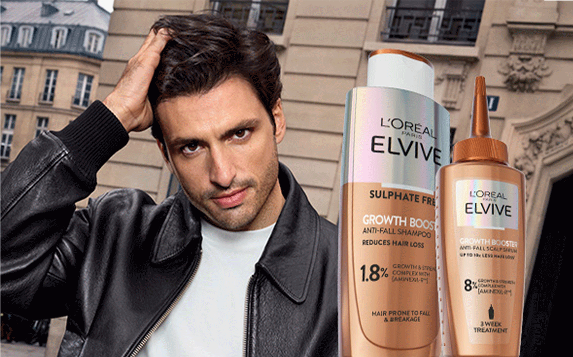 A model poses beside 3 L'Oreal Elvive products on a white background